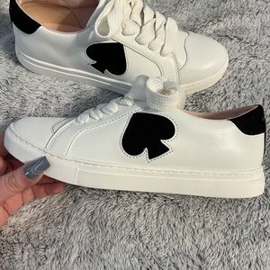 Kate Spade white leather and black suede sneakers.